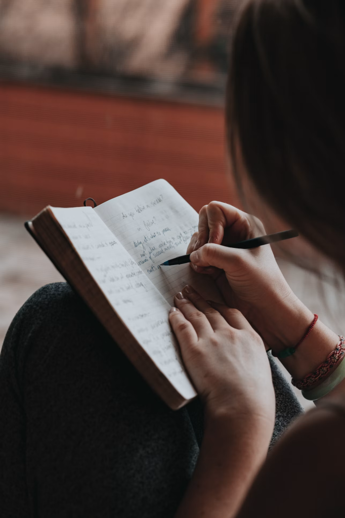 girl writing in her diary
